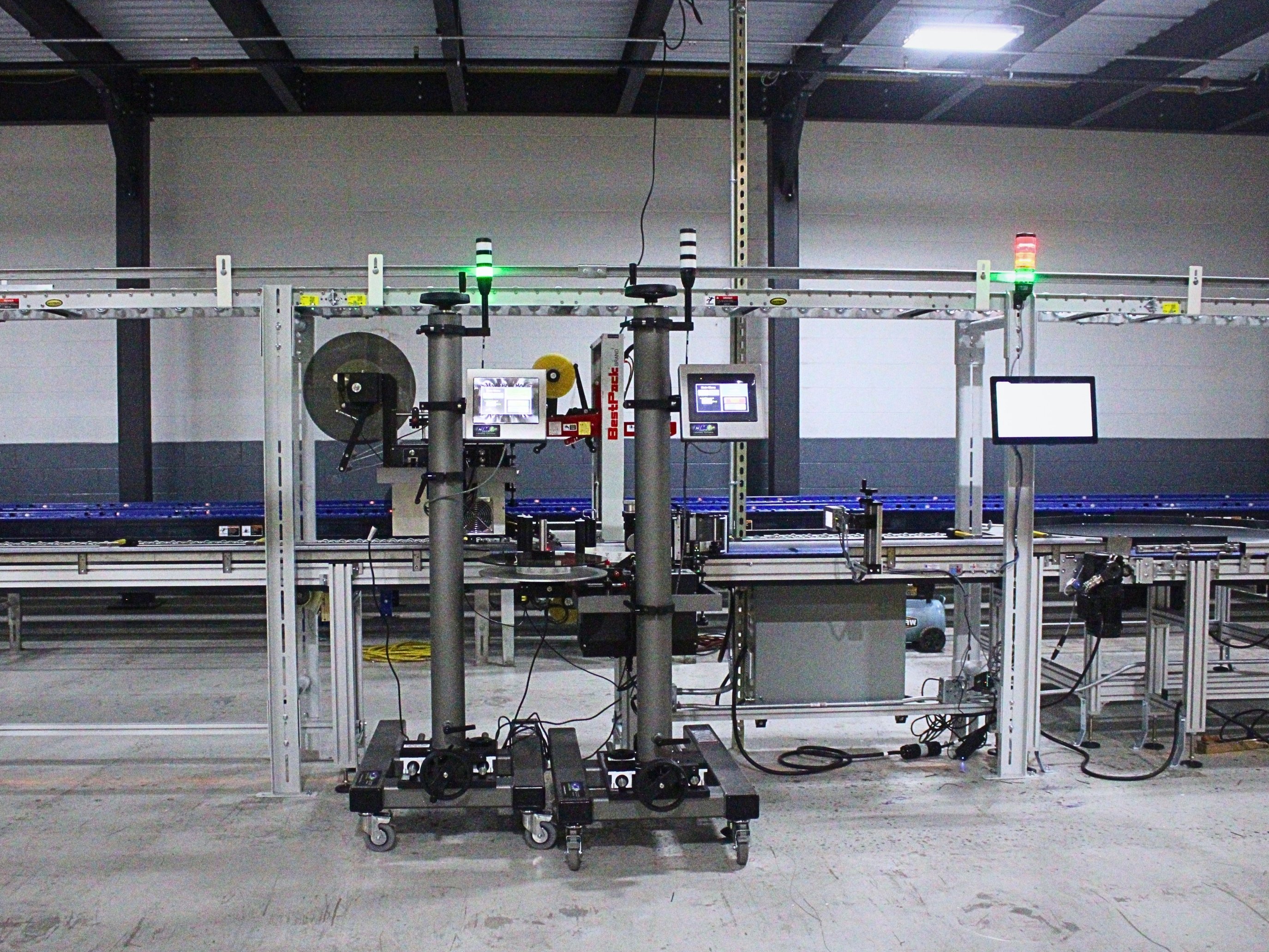 Front view of Caudalie’s labeling equipment and conveyor controls