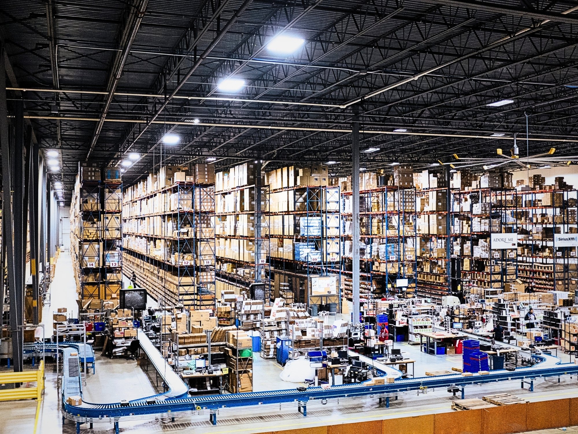 Warehouse overview showing storage racks and fulfillment work areas